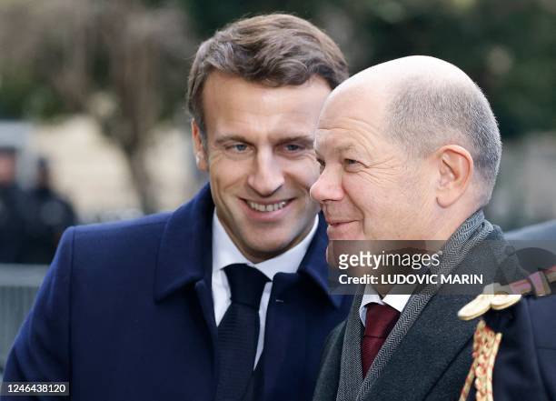 France's President Emmanuel Macron and German Chancellor Olaf Scholz arrive to attend a ceremony as part of the celebration of the 60th anniversary...