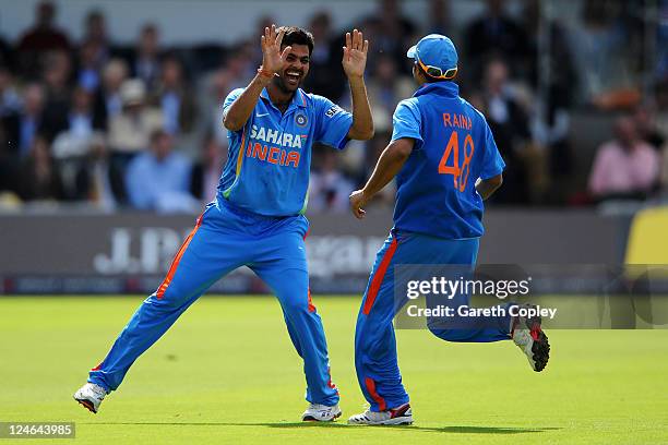 Singh of India celebrates with team mate Suresh Raina after claiming the wicket of Alastair Cook of England during the 4th Natwest One Day...