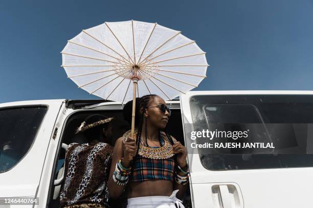 Zulu maiden dressed in traditional attire is seen during the reenactment of the Battle of Isandlwana, in Isandlwana on January 21, 2023. - The...