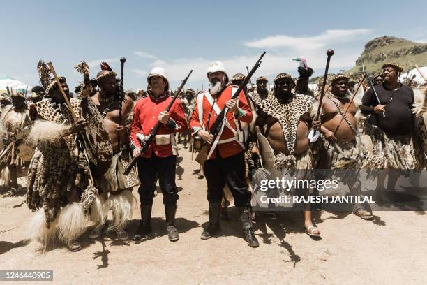Group the Dundeee Diehards in British uniforms stand ground as Zulu regiments walk past them during the reenactment of the Battle of Isandlwana, in...