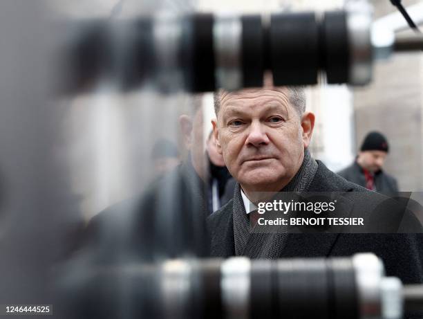 German Chancellor Olaf Scholz listens to explanations during a joint cabinet meeting presenting Franco-German industrial projects, as part of the...