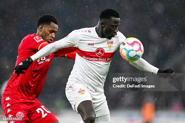 Edimilson Fernandes of 1.FSV Mainz 05 and Silas Katompa Mvumpa of VfB Stuttgart battle for the ball during the Bundesliga match between VfB Stuttgart...