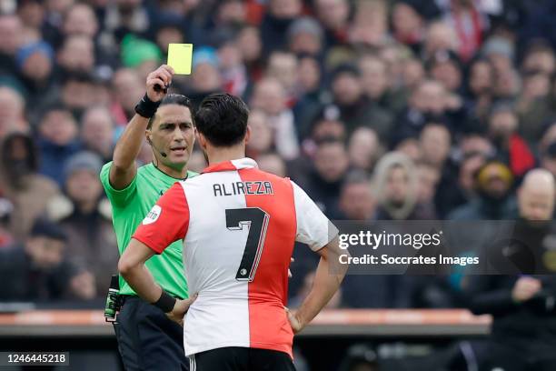 Referee Serdar Gozubuyuk gives a yellow card to Alireza Jahanbakhsh of Feyenoord for a headhunt against Jurrien Timber of Ajax during the Dutch...