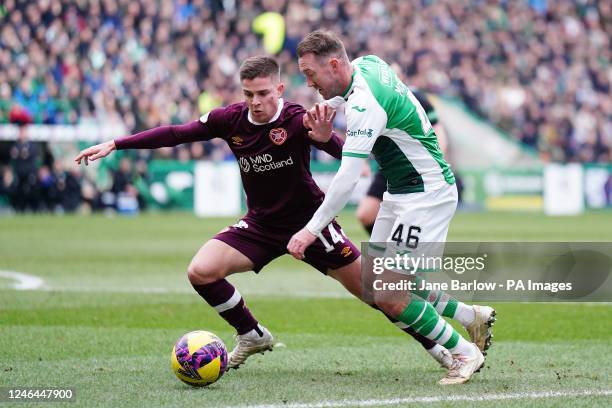 Hibernian's Aiden McGeady and Heart of Midlothian's Cameron Devlin battle for the ball during the Scottish Cup fourth round match at Hibernian,...