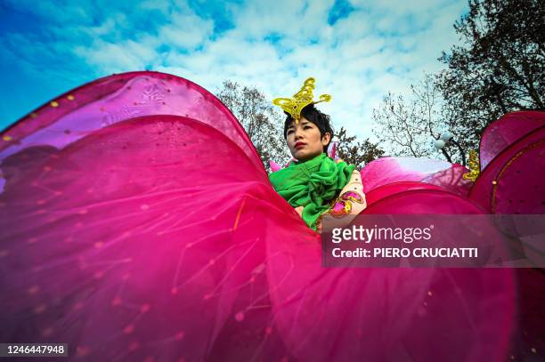 Performer takes part in a parade celebrating the Chinese Lunar New Year of the Rabbit, in central Milan, Italy, on January 22, 2023.