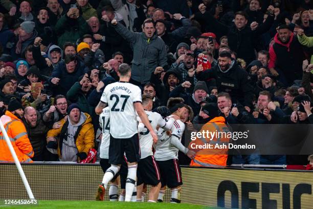 Lisandro Martinez of Manchester United celebrates scoring a goal to make the score 2-2 during the Premier League match between Arsenal FC and...