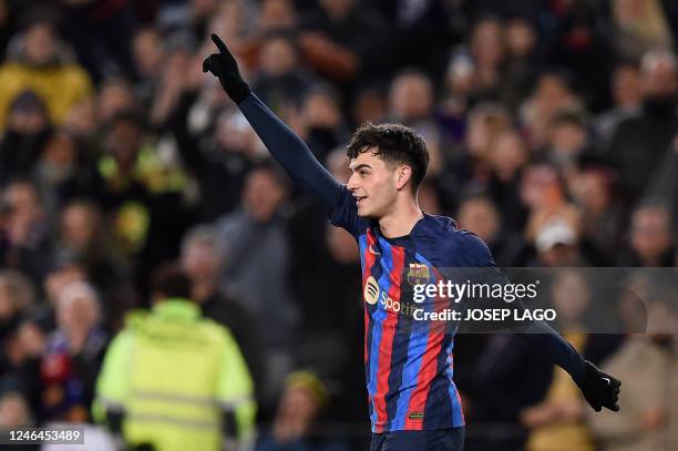 Barcelona's Spanish midfielder Pedri celebrates after scoring his team's first goal during the Spanish league football match between FC Barcelona and...