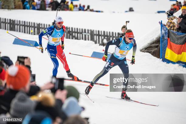 Benedikt Doll of Germany, Emilien Jacquelin of France in action competes during the Men 4x7.5 km Relay at the BMW IBU World Cup Biathlon...