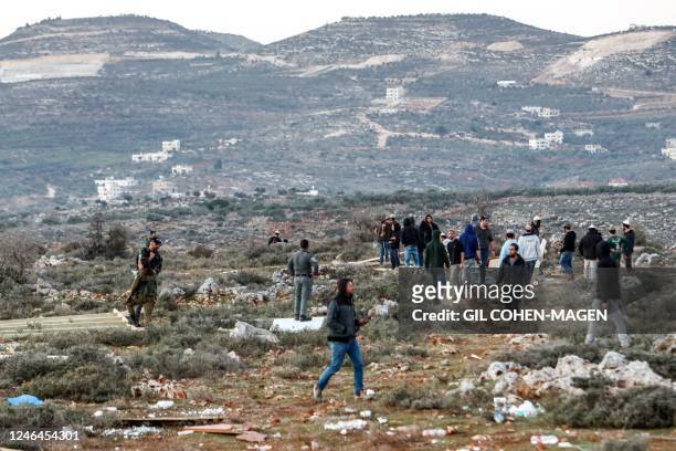 Israeli settlers gather in an attempt to reestablish an illegal settlement outpost called Or Haim, near the settelment of Migdalim, in the north of...