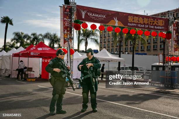 Officials secure and investigate the scene where a gunman opened fire at a ballroom dance studio in Monterey Park in Monterey Park in Monterey Park,...