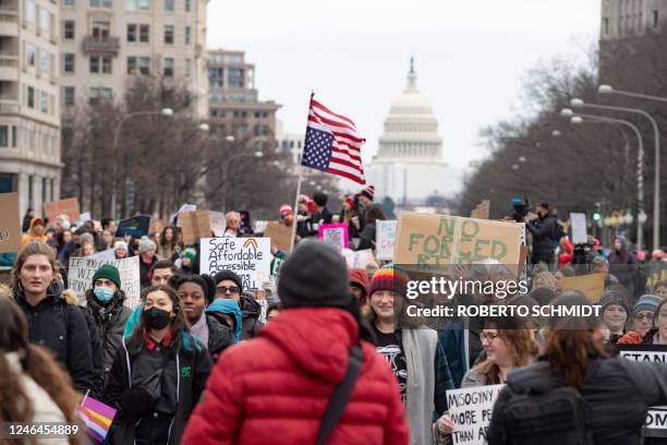 Demonstrators take part in the annual National Women's March in Washington, DC, on January 22 marking the 50th anniversary of the 1973 US Supreme...