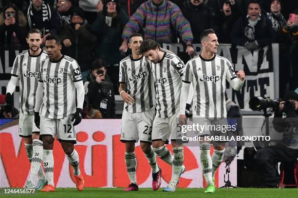 Juventus' Polish forward Arkadiusz Milik celebrates with teammates after scoring his team's second goal during the Italian Serie A football match...