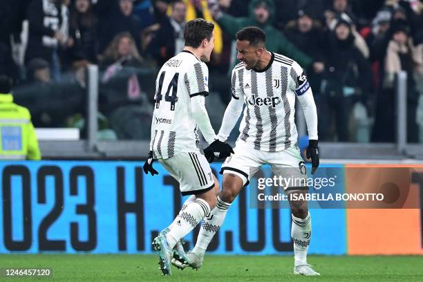 Juventus' Brazilian defender Danilo celebrates with Juventus' Italian midfielder Nicolo Fagioli after scoring his team's third goal during the...