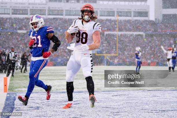 Hayden Hurst of the Cincinnati Bengals celebrates after scoring a touchdown against the Buffalo Bills during the first half at Highmark Stadium on...