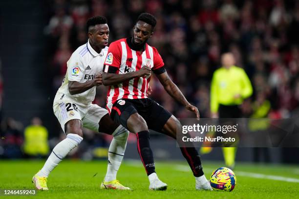 Vinicius Junior left winger of Real Madrid and Brazil and Iñaki Williams centre-forward of Athletic Club and Ghana controls the ball during the...