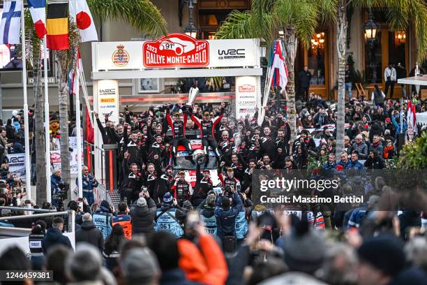 Sebastien Ogier of France and Vincent Landais of France celebrate their success during Day Four of the FIA World Rally Championship Monte-Carlo on...