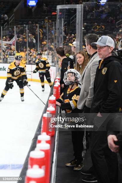 Phoenix, a Make A Wish child, watches warm ups of the Boston Bruins against the San Jose Sharks from the beach at the TD Garden on January 22, 2023...