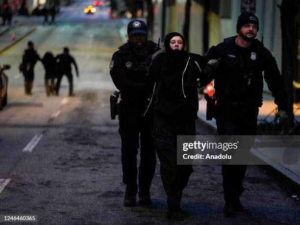 Police arrest a protestor during a "Stop cop city" protest in Atlanta, Georgia, United States on January 21, 2023. Multiple buildings were vandalized...