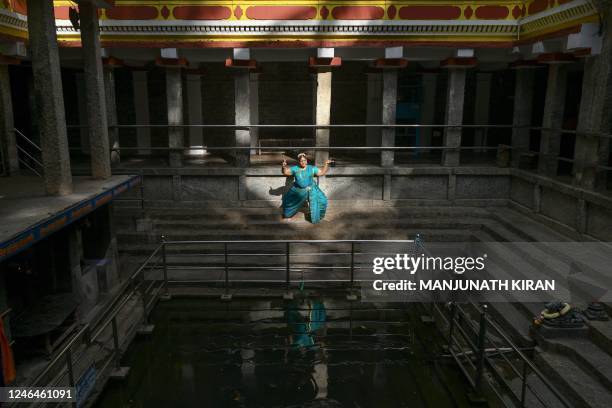 In this picture taken on September 25 Bharatanatyam dancer and art historian Gayathri Iyer performs a dance rendering the interaction of a Devadasi...