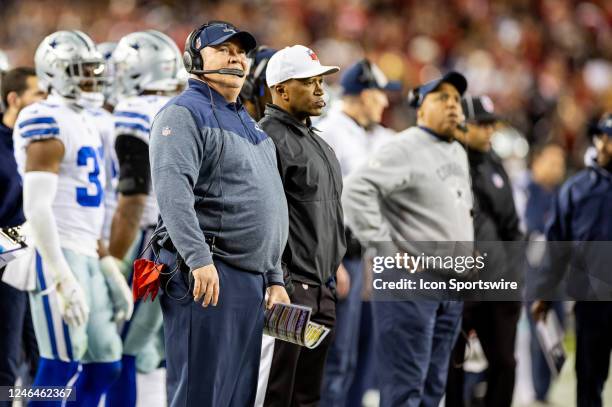 Dallas Cowboys head coach Mike McCarthy looks at the scoreboard during the NFL NFC Divisional Playoff game between the Dallas Cowboys and San...