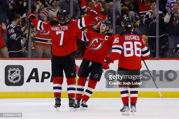 The New Jersey Devils celebrate after Dougie Hamilton scores the game-winning goal in overtime to defeat the Pittsburgh Penguins 2-1 at Prudential...