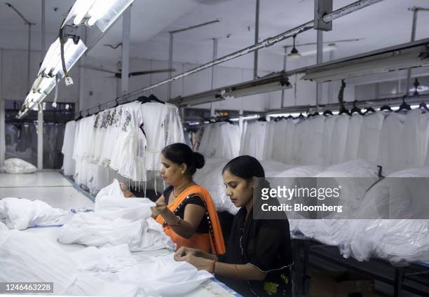 Employees at a garment manufacturing factory of Viraj Exports Pvt. In Noida, Uttar Pradesh, India, on Tuesday, Oct. 11, 2022. To compete with China,...