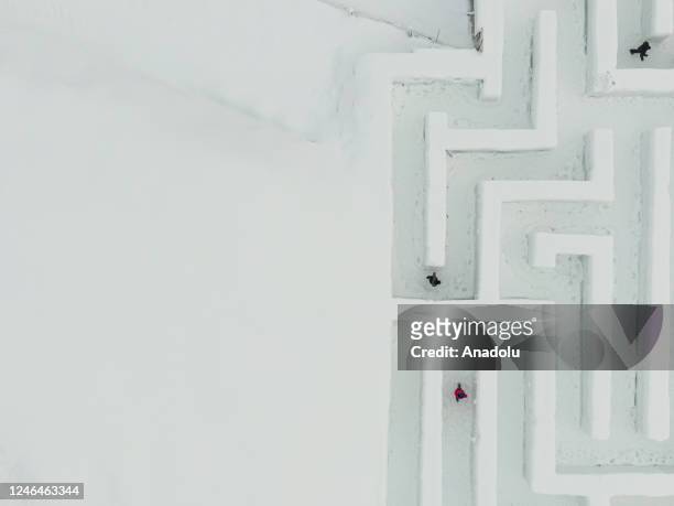 An aerial view of the Snowlandia Winter Theme Park's labyrinth as people try to find the way out in Zakopane, Poland on January 21, 2023. Established...