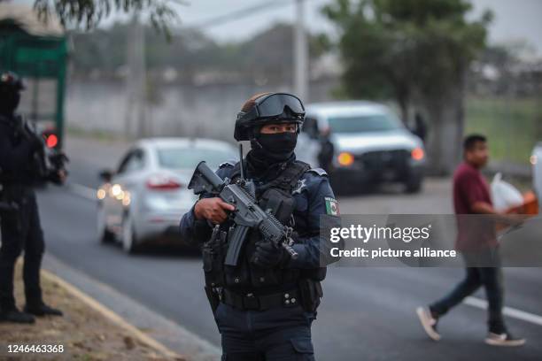 January 2023, Mexico, Veracruz: Police officers secure the area where a serious armed confrontation occurred in the Mexican city of Veracruz, killing...