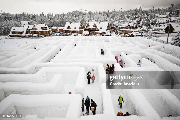 People are seen in Snowlandia Winter Theme Park's labyrinth as they try to find the way out in Zakopane, Poland on January 21, 2023. Established...