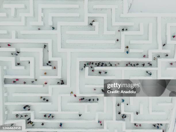 An aerial view of the Snowlandia Winter Theme Park's labyrinth as people try to find the way out in Zakopane, Poland on January 21, 2023. Established...