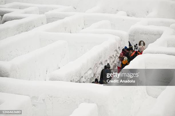 People are seen in Snowlandia Winter Theme Park's labyrinth as they try to find the way out in Zakopane, Poland on January 21, 2023. Established...