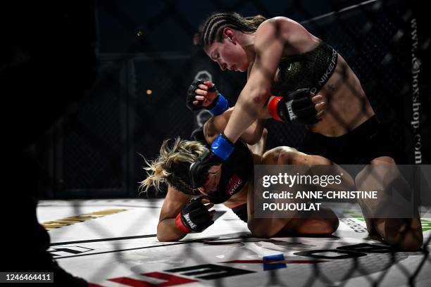 Lithuania's Ernesta Kareckaite competes against France's Laetitia Blot during the women's flyweight World Championship title bout at the Hexagone MMA...