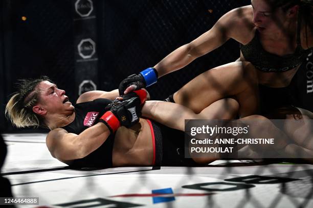 France's Laetitia Blot competes against Lithuania's Ernesta Kareckaite during the women's flyweight World Championship title bout at the Hexagone MMA...