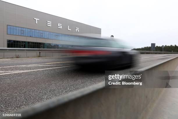 An automobile travels past the Tesla Inc. Gigafactory in Gruenheide, Germany, on Saturday, Jan. 21, 2023. Tesla CEO Elon Musk played down how much...