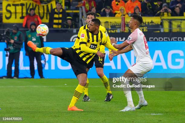 Sebastian Haller of Borussia Dortmund and Felix Uduokhai of FC Augsburg battle for the Ball during the Bundesliga match between Borussia Dortmund and...