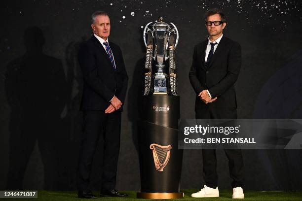 Italy's head coach Kieran Crowley and France's head coach Fabien Galthie pose with the Six Nations trophy, ahead of their first match, during the 6...