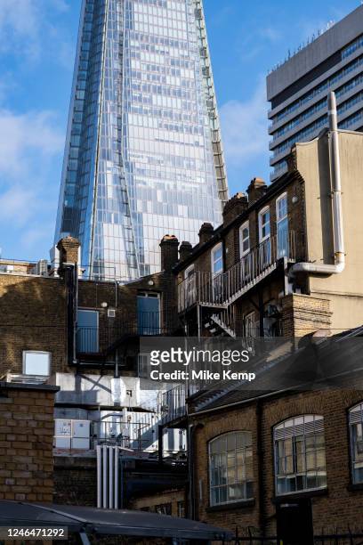 The Shard looming over buildings in London Bridge, Southwark on 11th January 2023 in London, United Kingdom. The Shard, also referred to as the Shard...