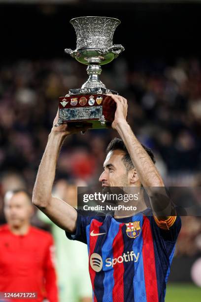 Sergio Busquets of FC Barcelona celebrates the Super Copa of Spain with the trophy during the La Liga match between FC Barcelona v Getafe CF at...