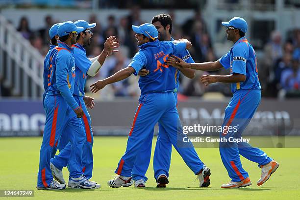 Singh of India celebrates with team mates after claiming the wicket of Alastair Cook of England during the 4th Natwest One Day International match...