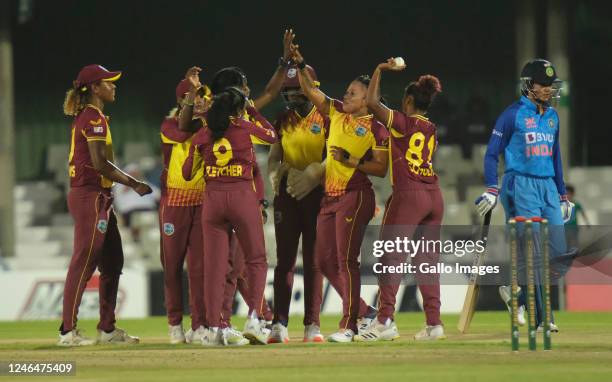 West Indies players celebrate a wicket during the Women's T20I Tri-Series match between India and West Indies at Buffalo Park on January 23, 2023 in...