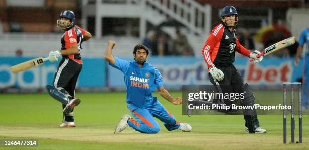 Munaf Patel of India fields the ball off his own bowling before running out Graeme Swann of England as Ravi Bopara of England looks on during the 4th...