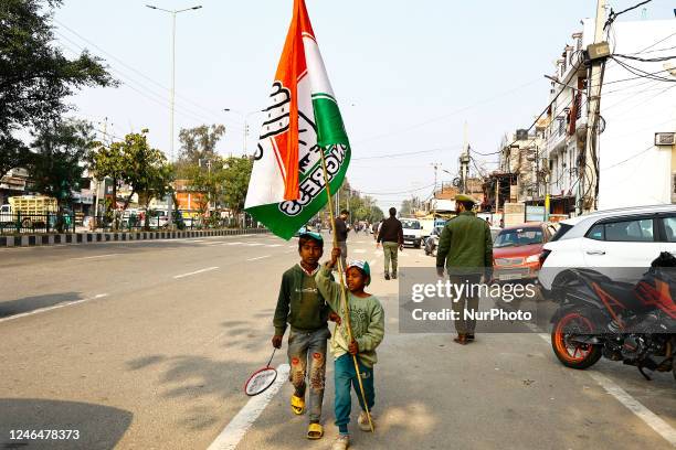 Kids carry a flag of Indian National Congress during Bharat Jodo Yatra in Jammu City Jammu and Kashmir India on 23 January 2023