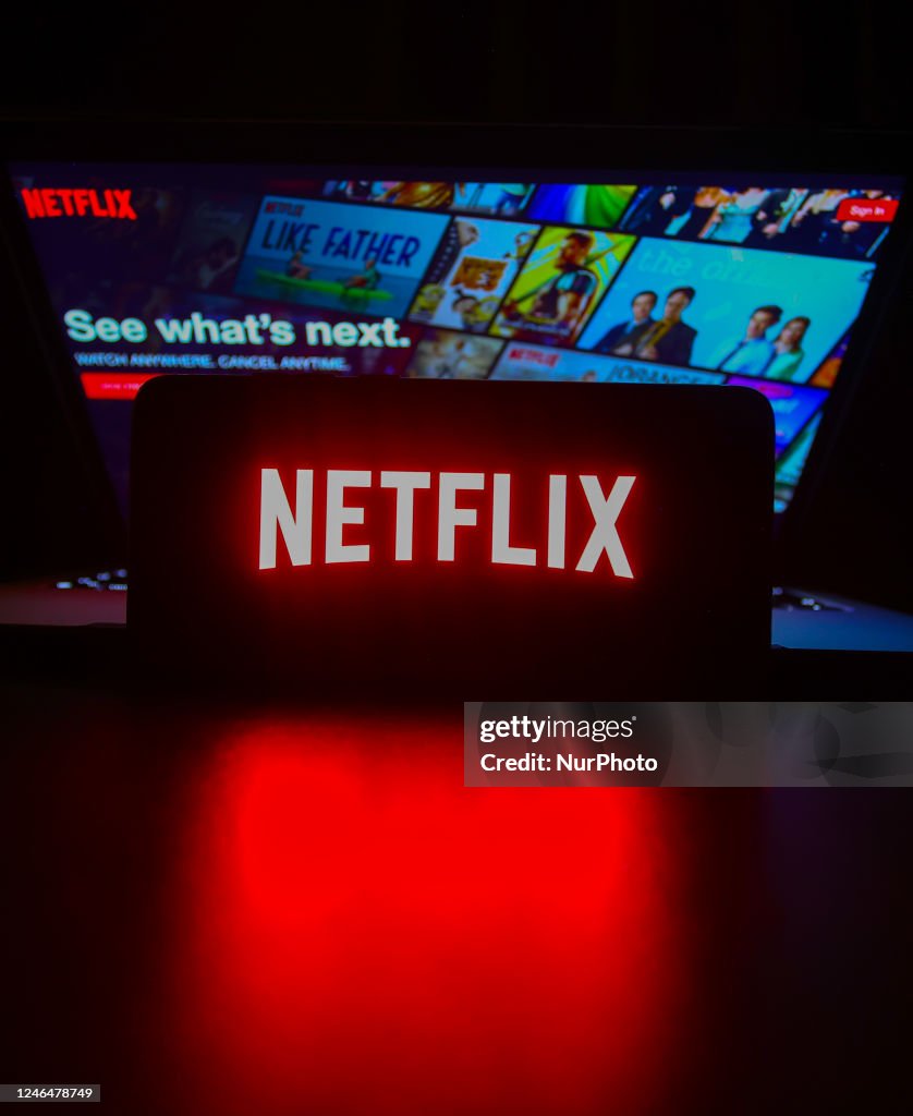 Netflix logo is displayed on a mobile phone screen with Netflix... News ...