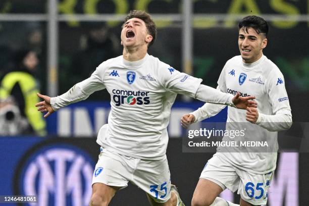 Empoli's Italian midfielder Tommaso Baldanzi celebrates after opening the scoring during the Italian Serie A football match between Inter and Empoli...