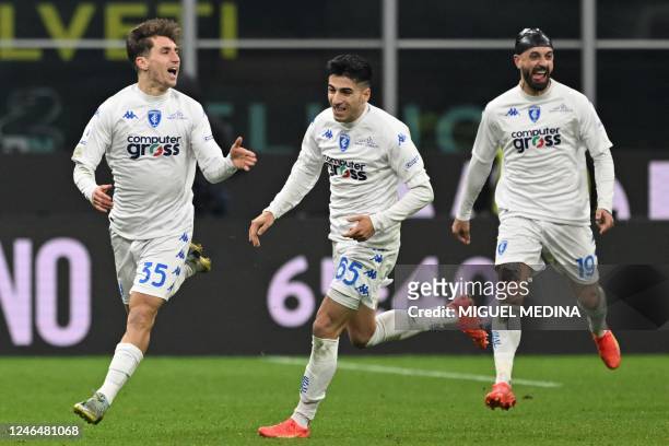 Empoli's Italian midfielder Tommaso Baldanzi celebrates after opening the scoring during the Italian Serie A football match between Inter and Empoli...