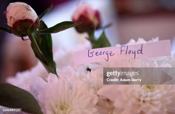 Piece of paper reads the name George Floyd amidst those of others who lost their lives to police brutality, at the restaurant Rosa Caleta on June 5,...