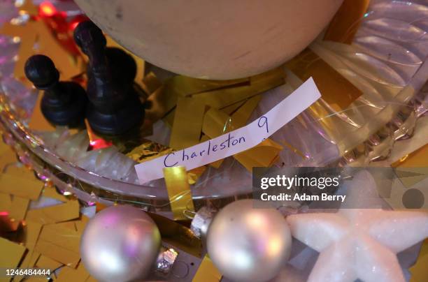 Piece of paper reads Charleston 9, referring to the nine black people killed by a white supremacist at Charleston's Mother Emanuel AME Church, amidst...