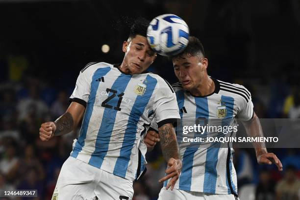 Argentina's Santiago Castro and Alejo Veliz jump for a header during their South American U-20 championship first round football match against Brazil...
