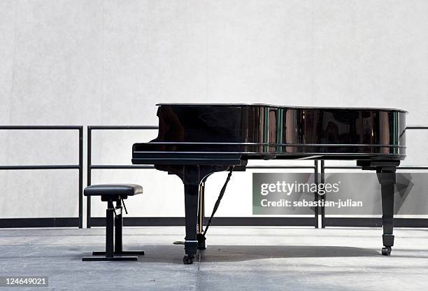 grand piano on stage - musical instruments no people stock pictures, royalty-free photos & images