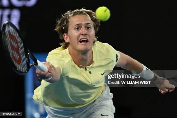 S Sebastian Korda hits a return against Russia's Karen Khachanov during their men's singles quarter-final match on day nine of the Australian Open...